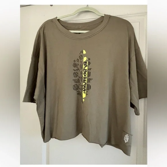 Free People Movement Fitness. Graphic Oversized T-Shirt in Olive and Yellow. - Picture 1 of 5